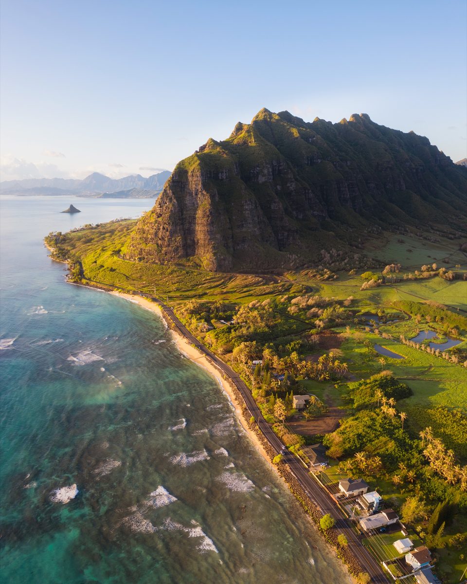 Aerial view along the Kaʻaʻawa coastline toward the ridge of Kaʻaʻawa Valley at dawn
